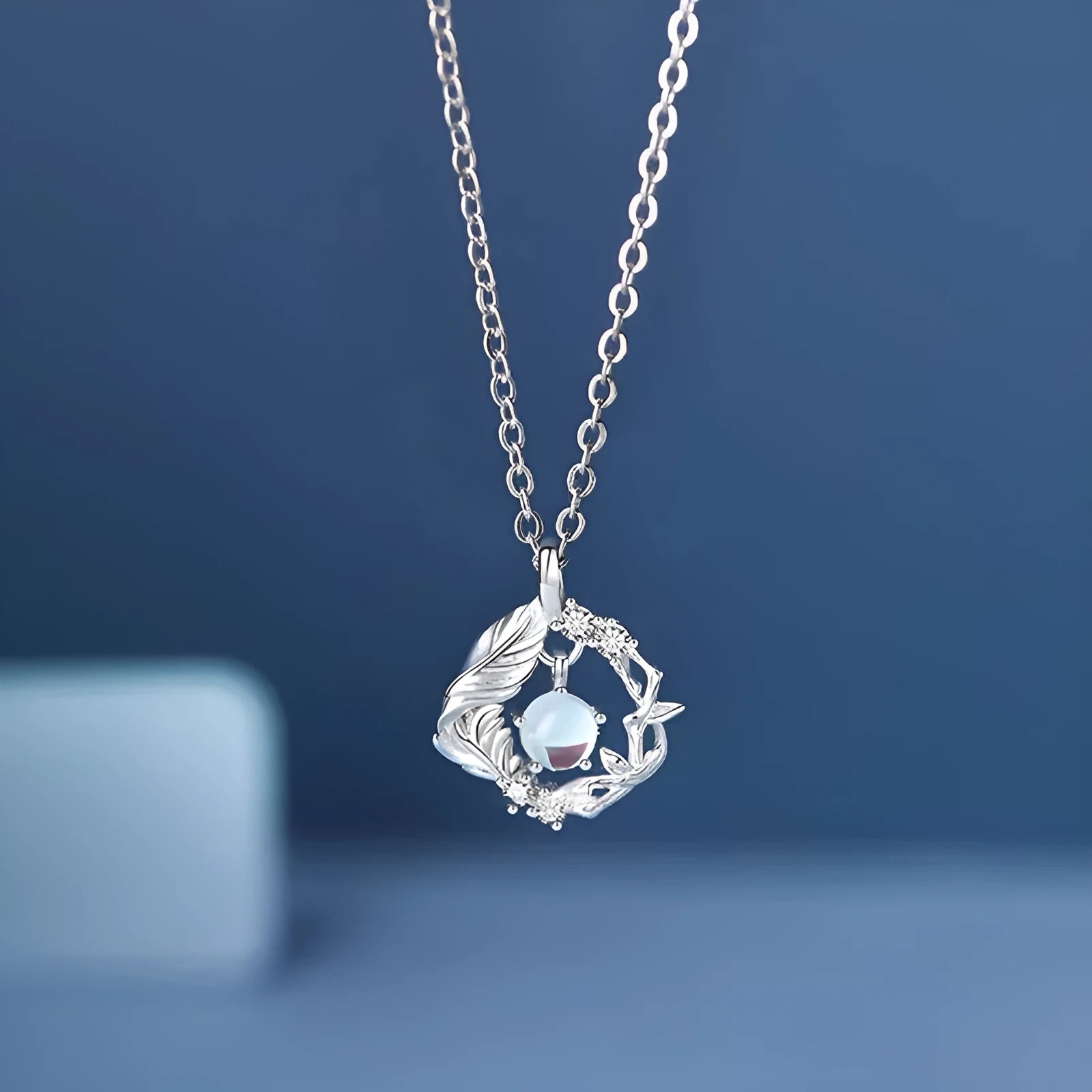Geometric tree and bluebird pendant necklace on adjustable chain with eucalyptus blue colour option