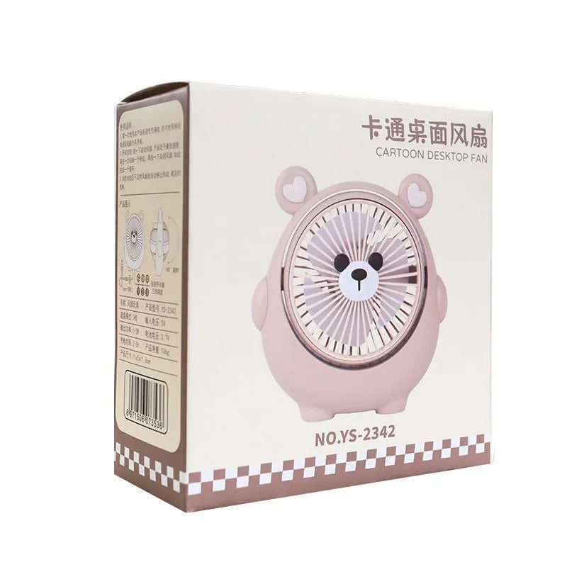 Cute dog-themed desktop electric fan with USB cable and multiple colour options on a desk.