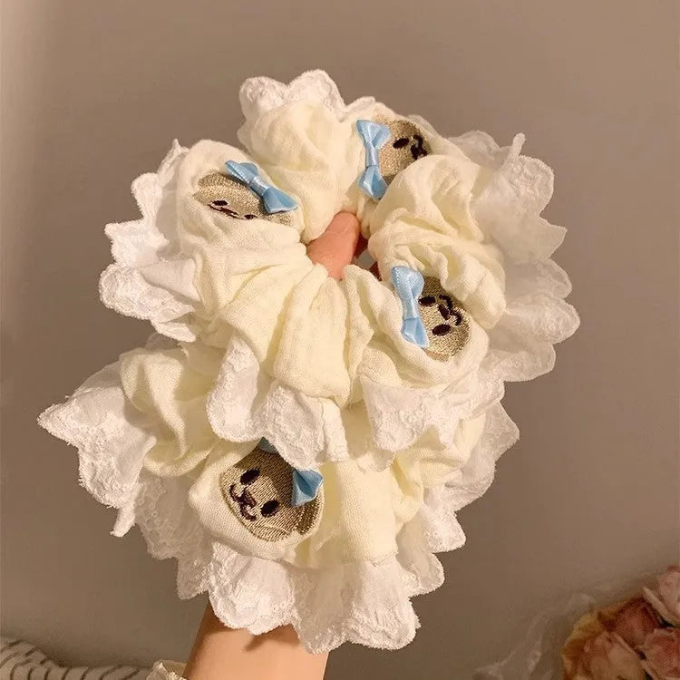 Bear blue cloth hair ring with bow and lace trim on elasticated large intestine headband