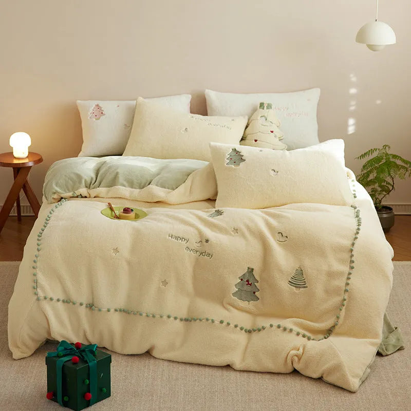 Milk fibre bedding set with green Christmas tree pattern showing quilt cover, fitted sheet, and pillowcases arranged on bed