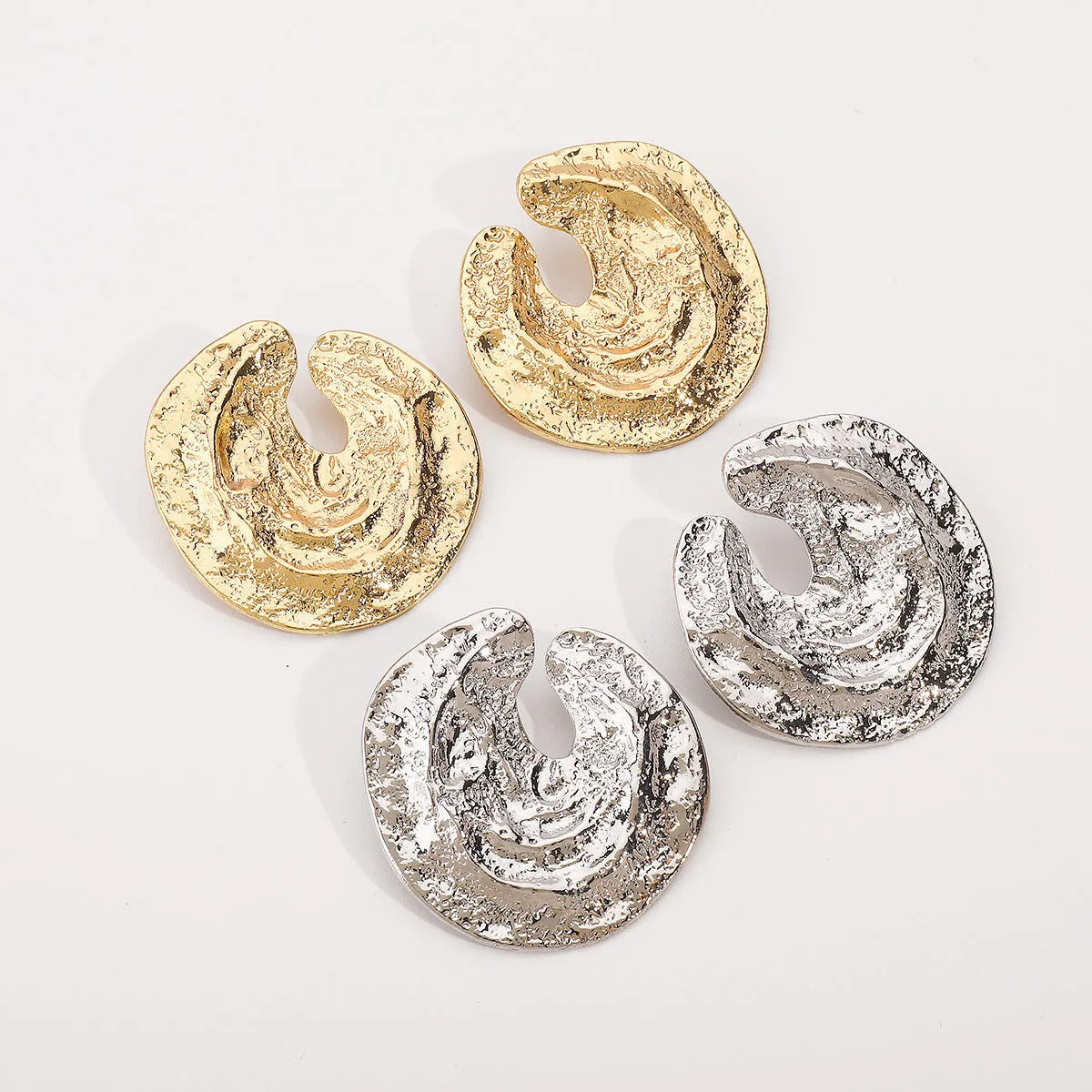Exaggerated geometric women's earrings with irregular pleating and concave-convex texture in gold colour