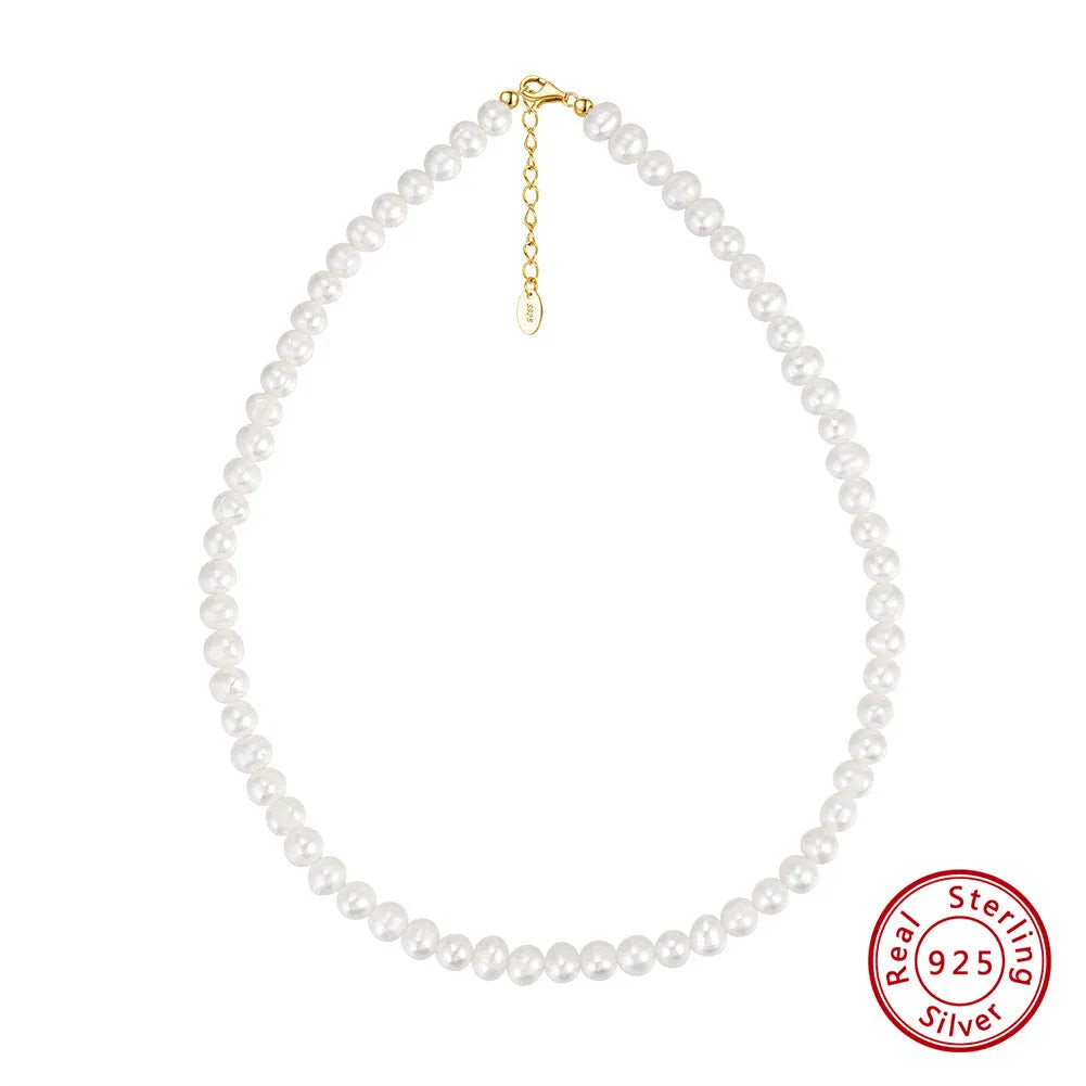 Adjustable silver necklace with a string of freshwater pearls on a model