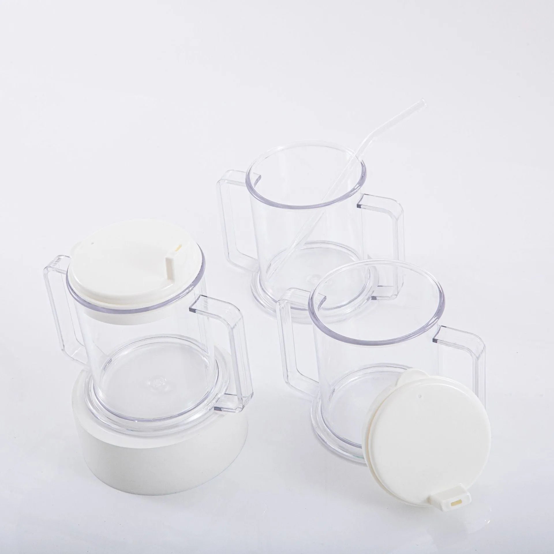Transparent plastic drinking cup with secure lid showing dimensions and spill-proof design