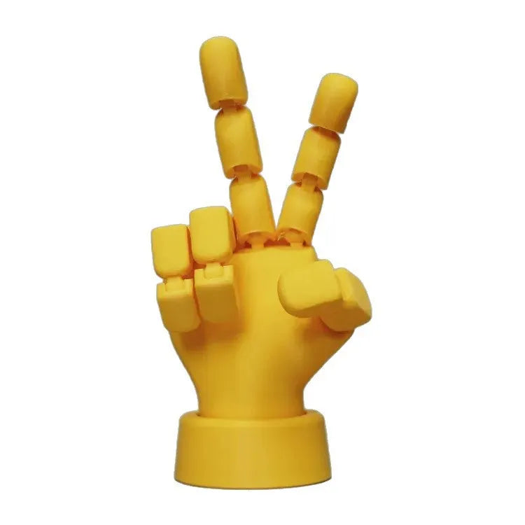 Yellow movable joint hand prop ornament on a white background.