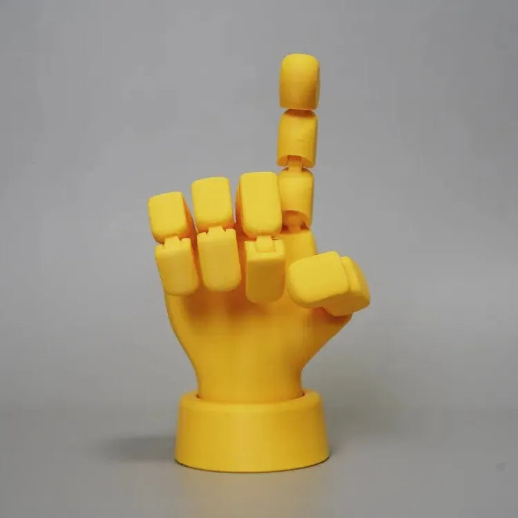 Yellow movable joint hand prop ornament on a white background.