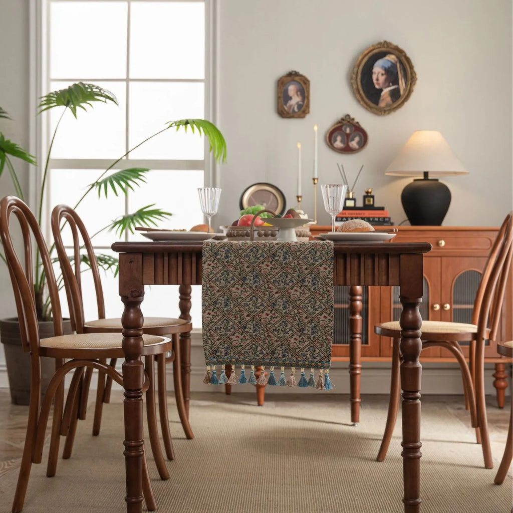 Nordic jacquard table runner with tassel fringe in dark blue with striped pattern on wooden table