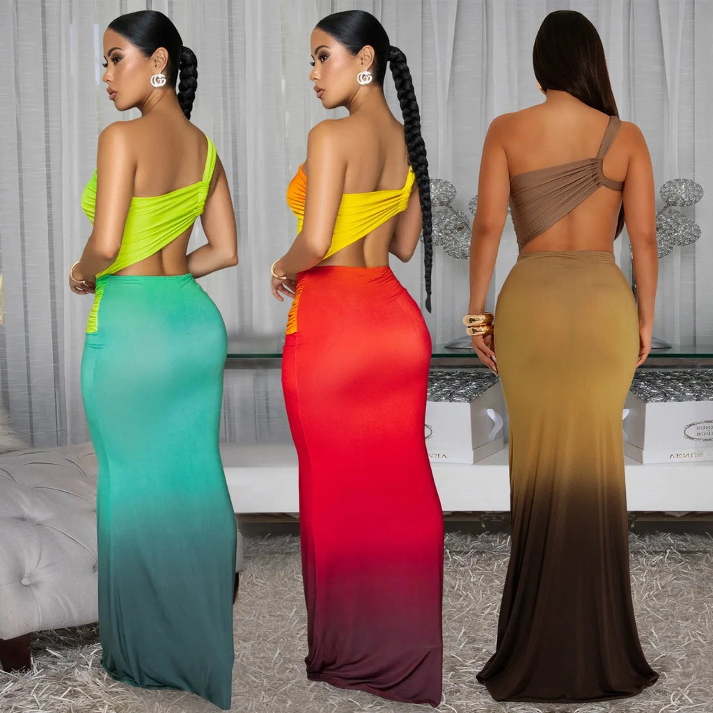 Women's gradient colour asymmetric cross-shoulder sleeveless dress with a high waist and long skirt.