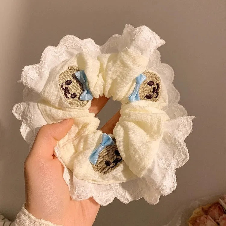 Bear blue cloth hair ring with bow and lace trim on elasticated large intestine headband