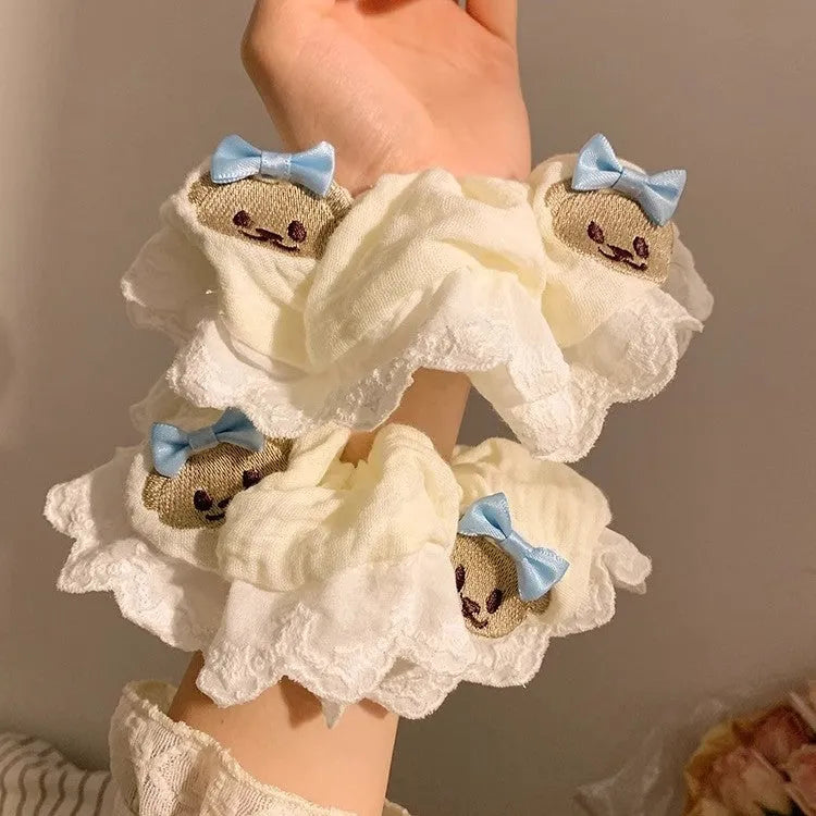 Bear blue cloth hair ring with bow and lace trim on elasticated large intestine headband