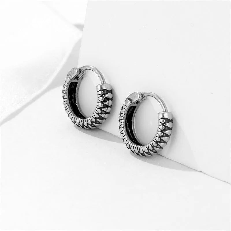Silver geometric retro twist earrings made from stainless steel with a striped pattern.