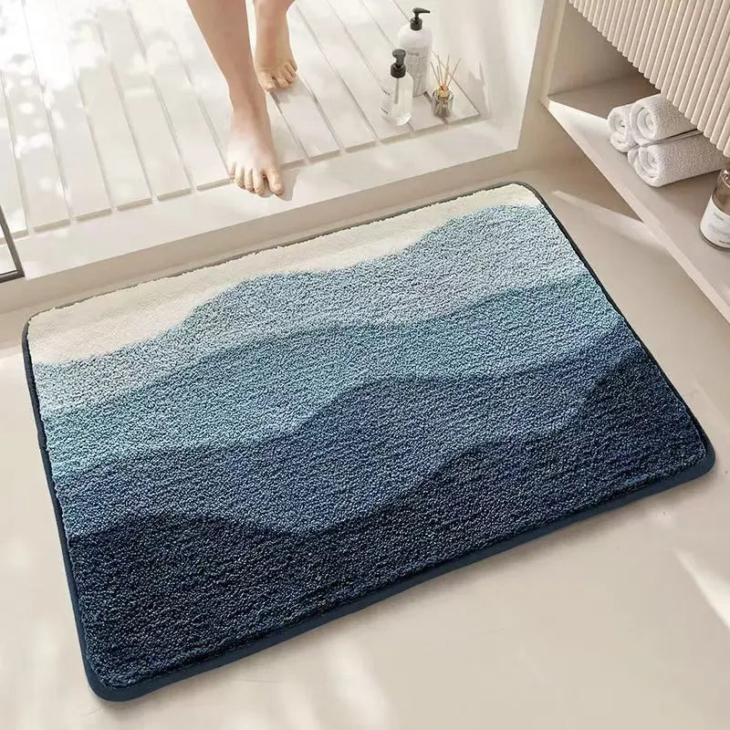 Square sky sea coloured floor mat with a printed rainbow pattern, flat polyester fibre texture.