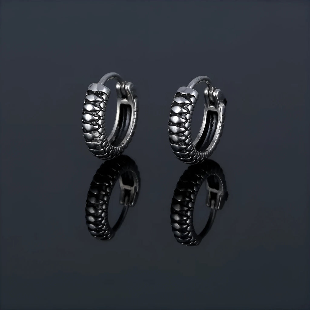 Silver geometric retro twist earrings made from stainless steel with a striped pattern.