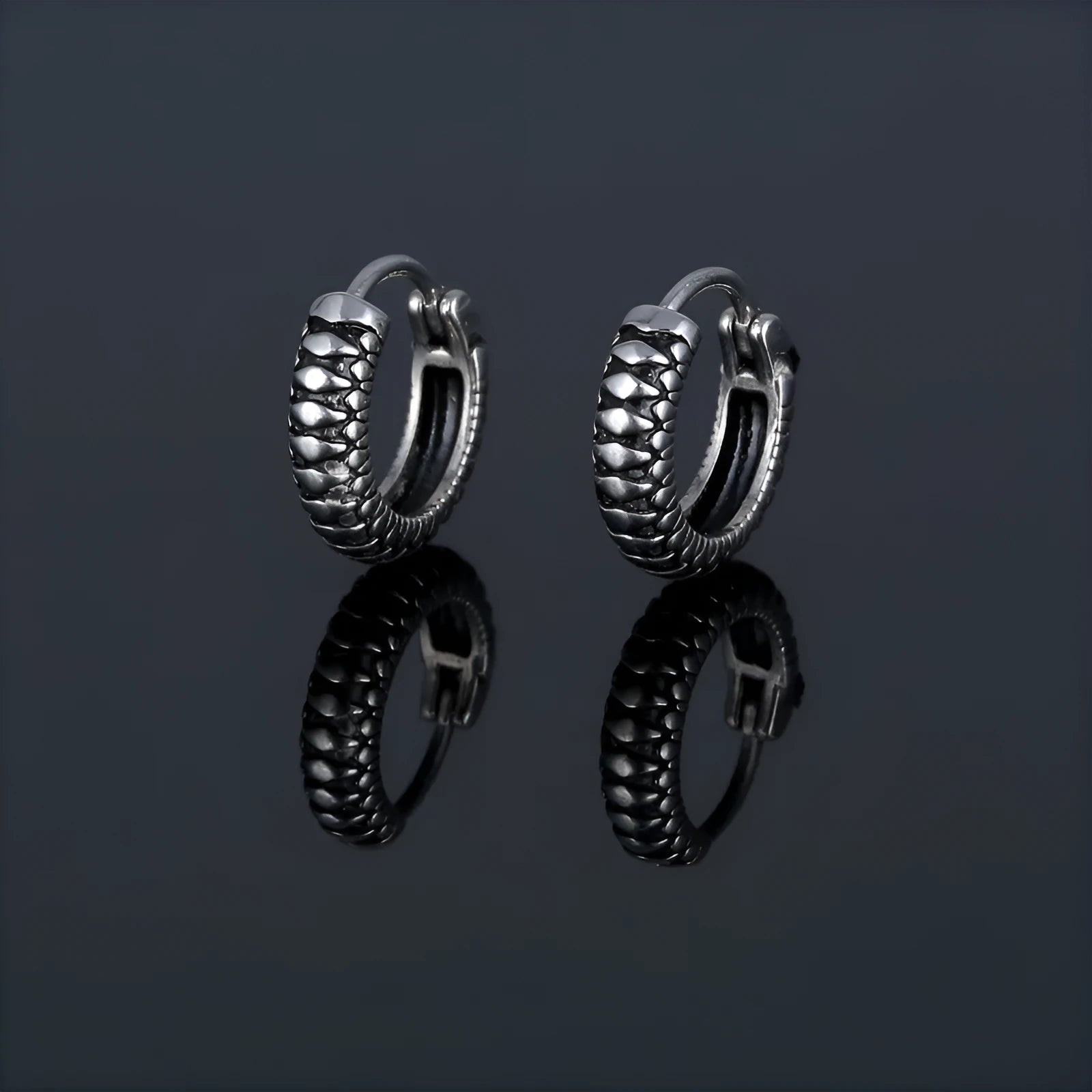 Silver geometric retro twist earrings made from stainless steel with a striped pattern.