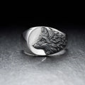 Silver alloy men's ring featuring a geometric wolf head design on a finger.