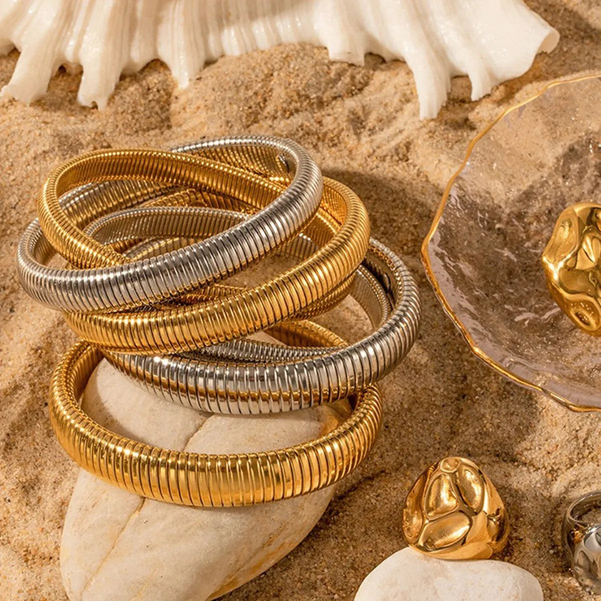 Women's titanium steel bracelet with vertical stripe ring design in gold or silver colour