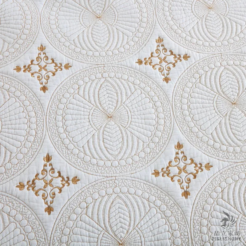 Pure cotton embroidered bed cover set with pillowcases on a double bed.