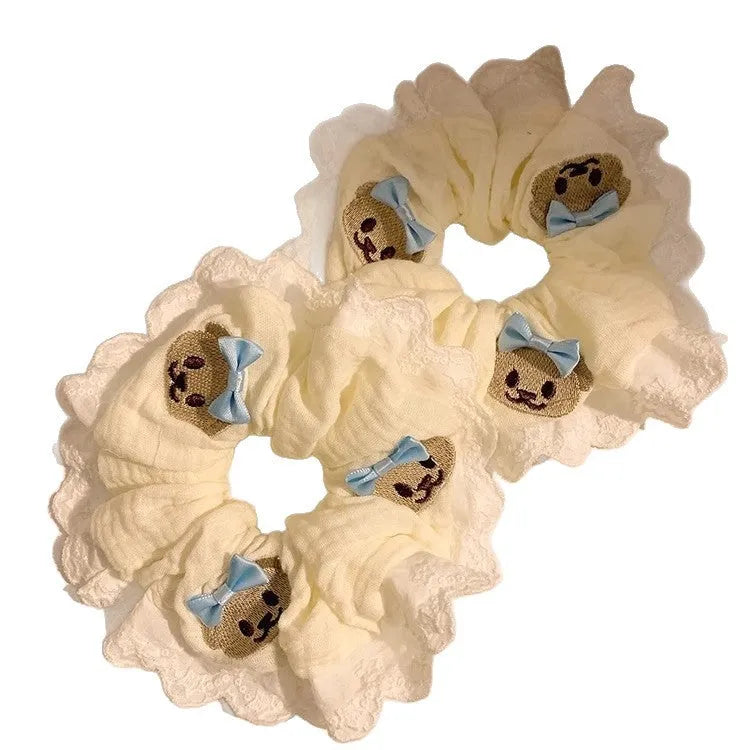 Bear blue cloth hair ring with bow and lace trim on elasticated large intestine headband