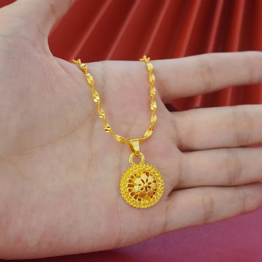Gold-plated three-piece jewellery set showing necklace with pendant, earrings, and ring with middle eastern flower design