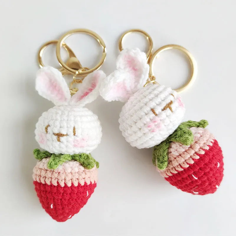 Hand-woven colourful wire pendant shaped like a rabbit with a strawberry, featuring a key loop.