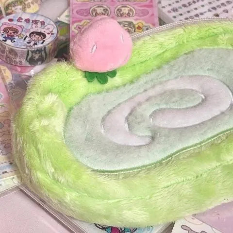 Korean style velvet pencil case designed like a swiss roll cake for stationery storage.