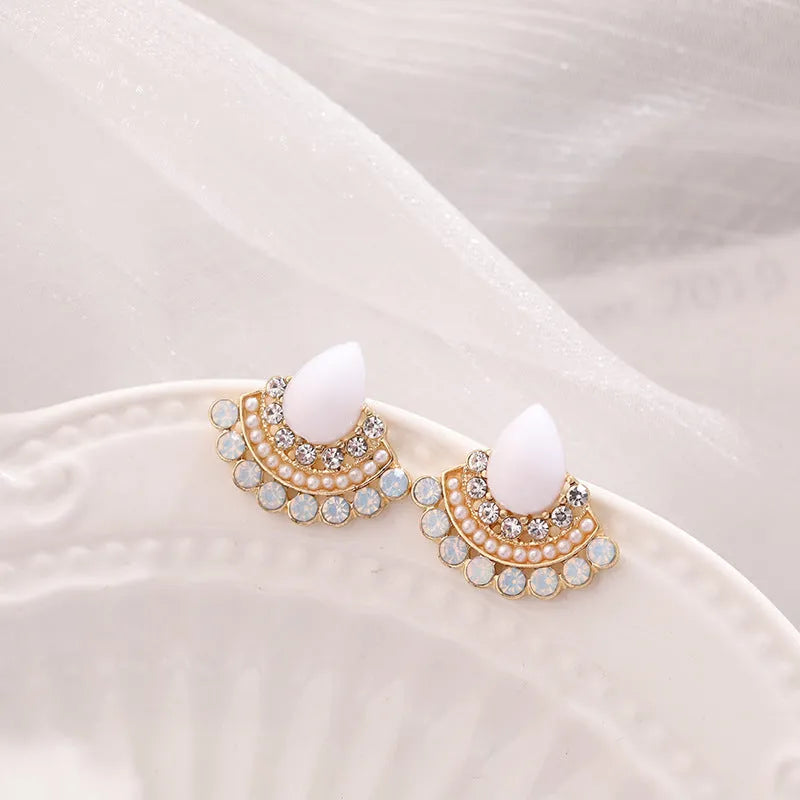 Retro fan-shaped silver colour alloy earrings with rhinestone and opal decorative details.