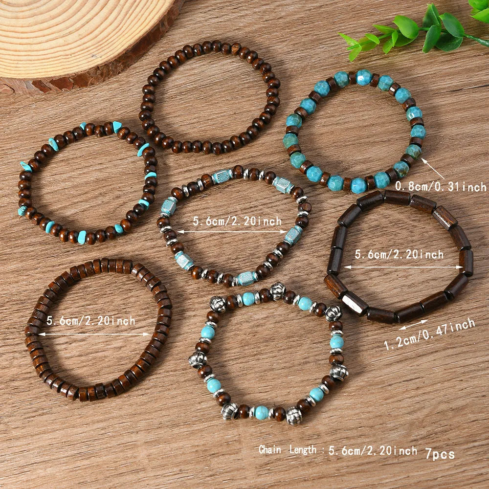 Set of seven multicolour retro bracelets with wooden beads and alloy details.