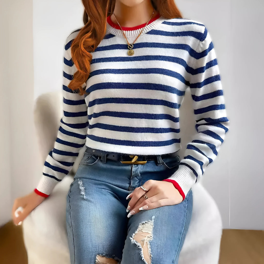 Sapphire blue loose-fit striped knitted pullover jumper with round neck and long sleeves.