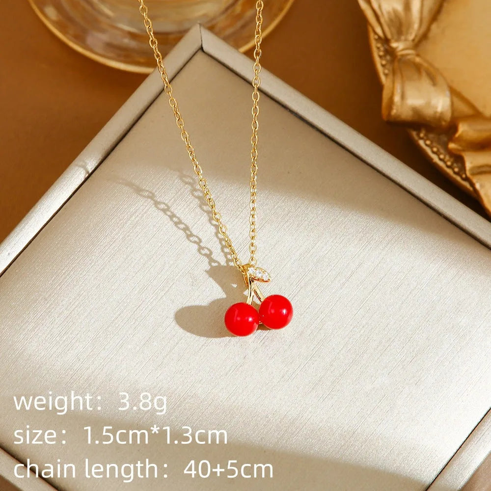 Delicate indie cherry strawberry pepper necklace on a titanium steel O-ring chain