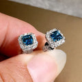 Square-cut bright green zircon earrings in gold, rose gold, and white gold electroplated finishes.