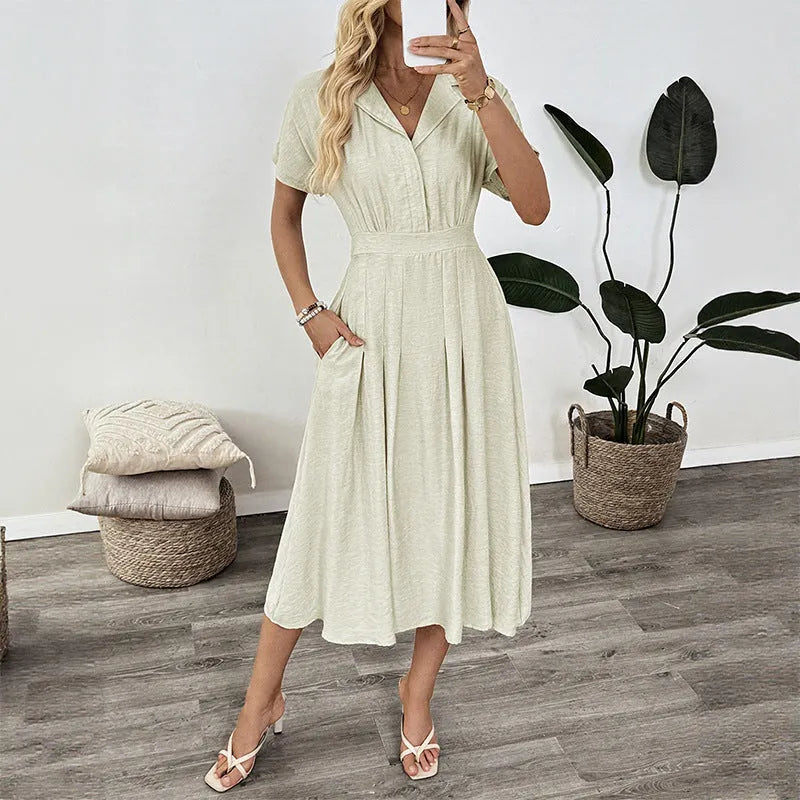 Light green shirt dress with lapel collar, waist tie, and side pockets