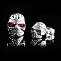 Retro skull stud earrings with red eye ghost head design and gemstone inlays on alloy base
