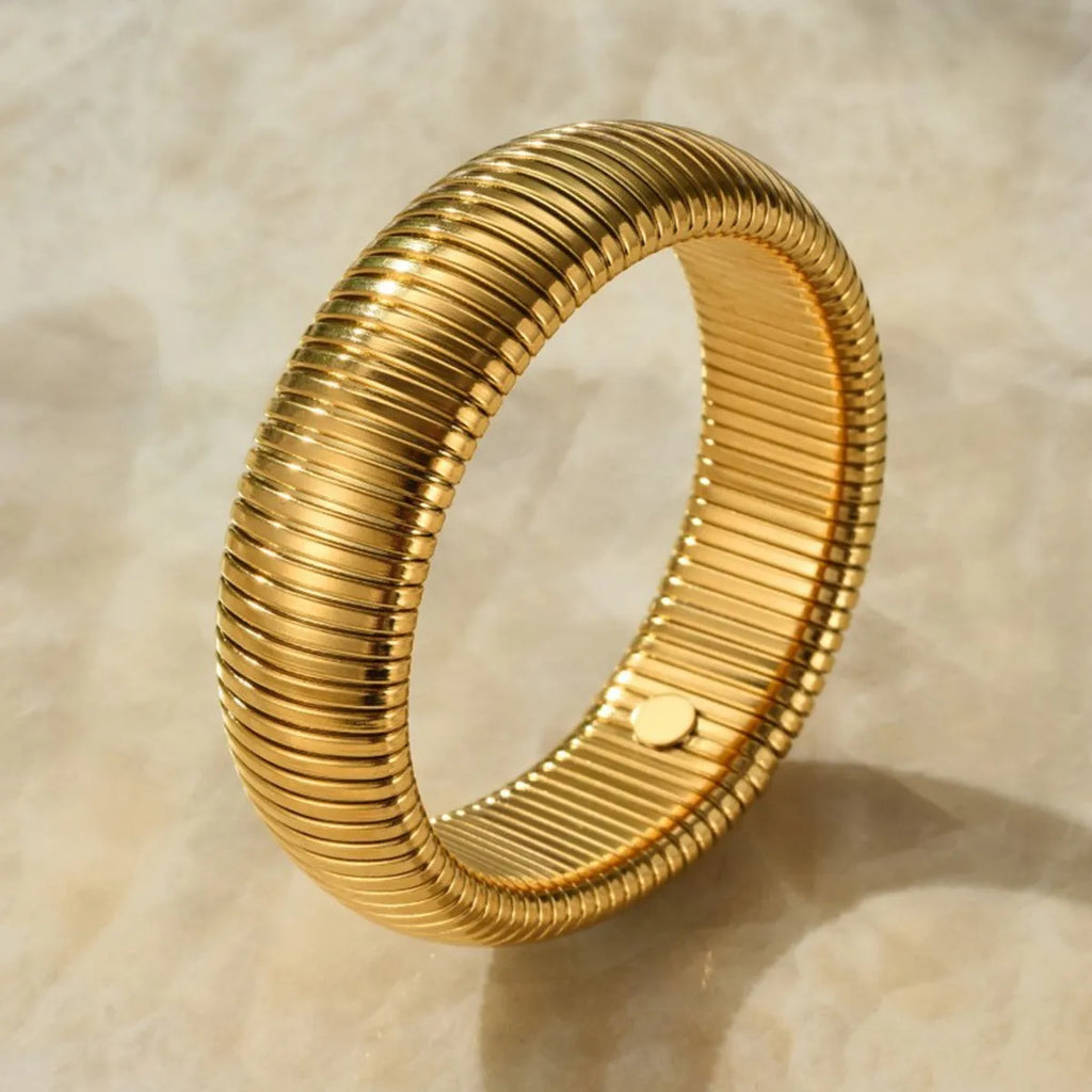 Women's titanium steel bracelet with vertical stripe ring design in gold or silver colour