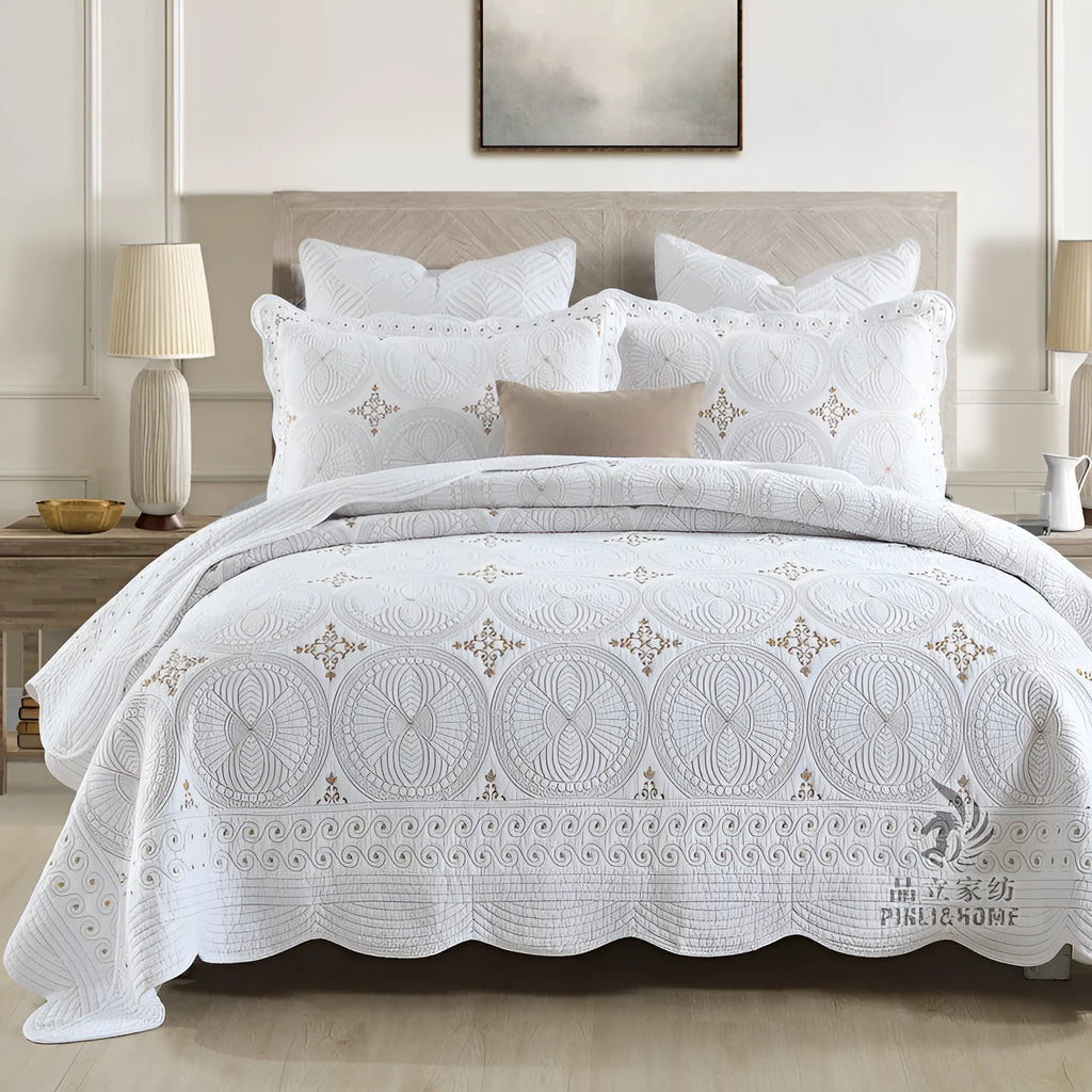 Pure cotton embroidered bed cover set with pillowcases on a double bed.