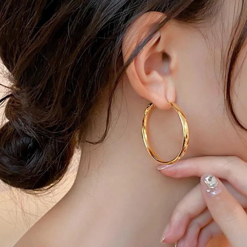40mm circular metal earrings in gold and silver electroplated finishes