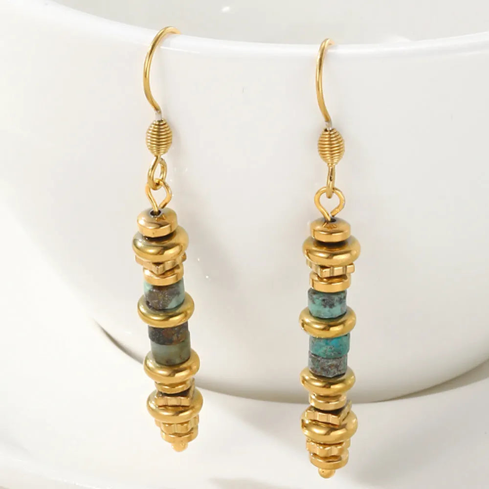 A pair of women's geometric retro dangle earrings in titanium steel with an 18K finish.