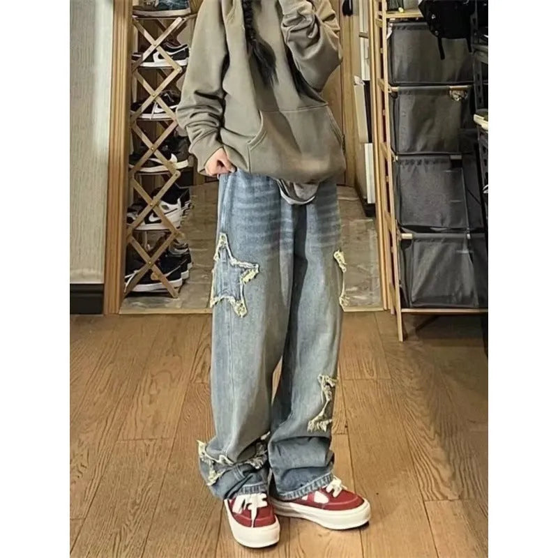 Blue women's high waist straight-leg jeans made from cotton denim on a neutral background.