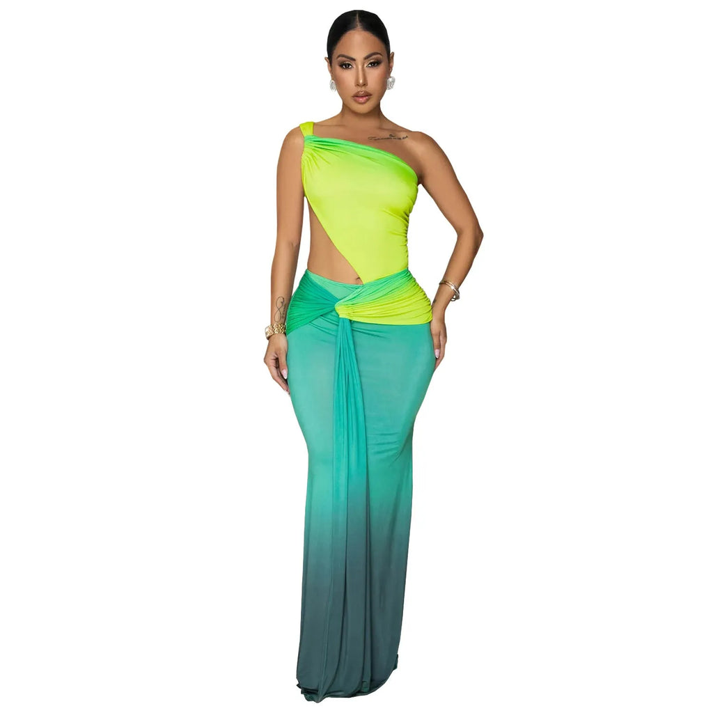 Women's gradient colour asymmetric cross-shoulder sleeveless dress with a high waist and long skirt.