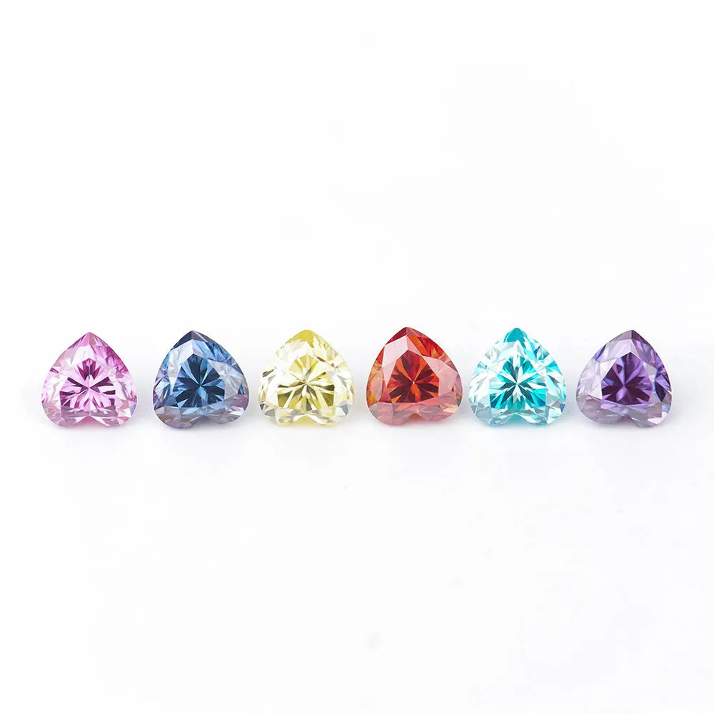 Colourful heart-shaped moissanite gemstones in red, blue, yellow, and pink for jewellery making.