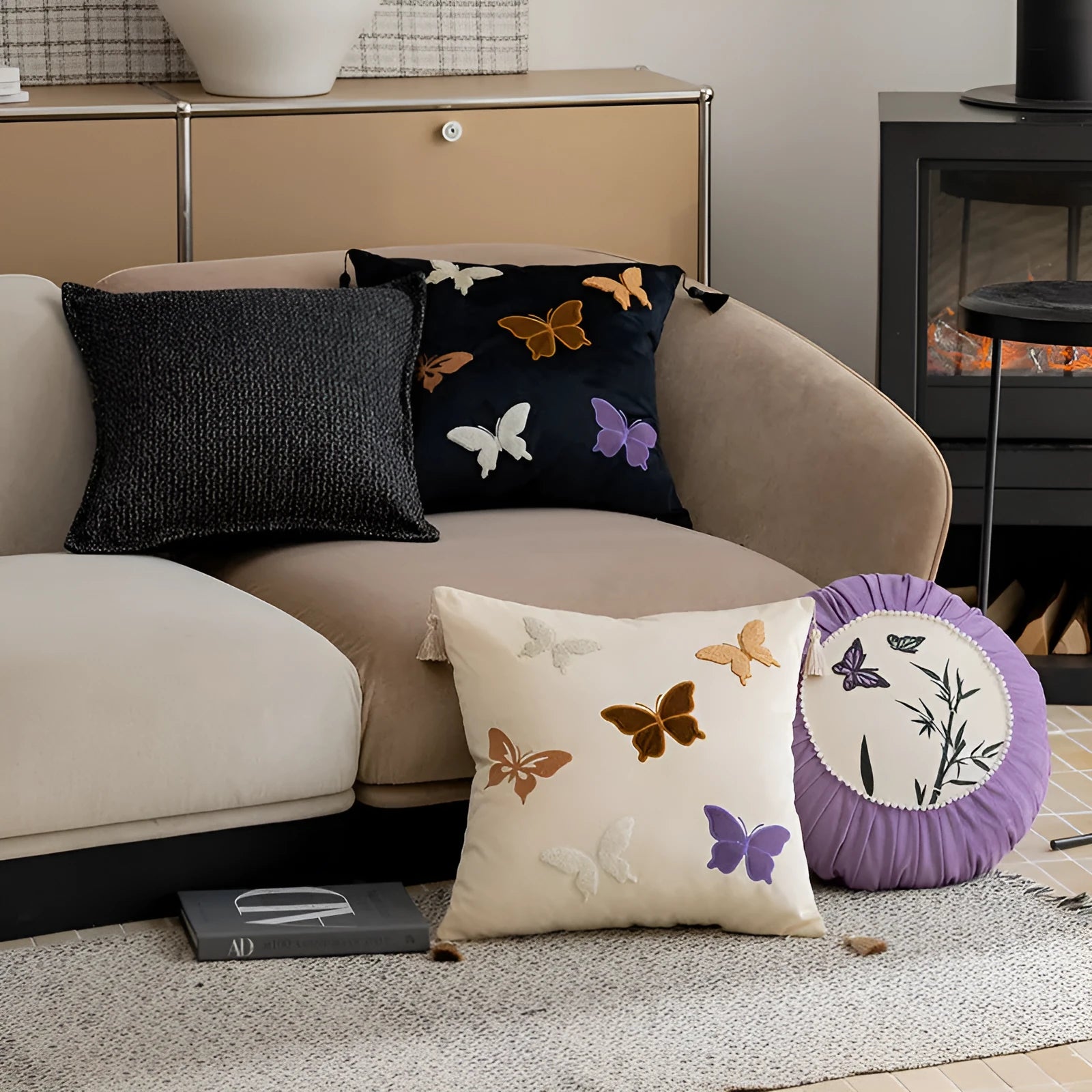 Square beige cushion with detailed black butterfly embroidery in a Chinese style.