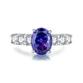 Close-up of a women's heart-shaped sterling silver ring with a faceted ice flower cut zircon gemstone.