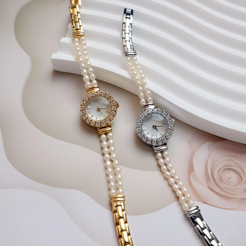 Women's light gold bracelet watch with a freshwater pearl dial and stainless steel strap