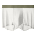 Man wearing bean green ice silk antibacterial graphene shorts with a seamless, mid-waist design.