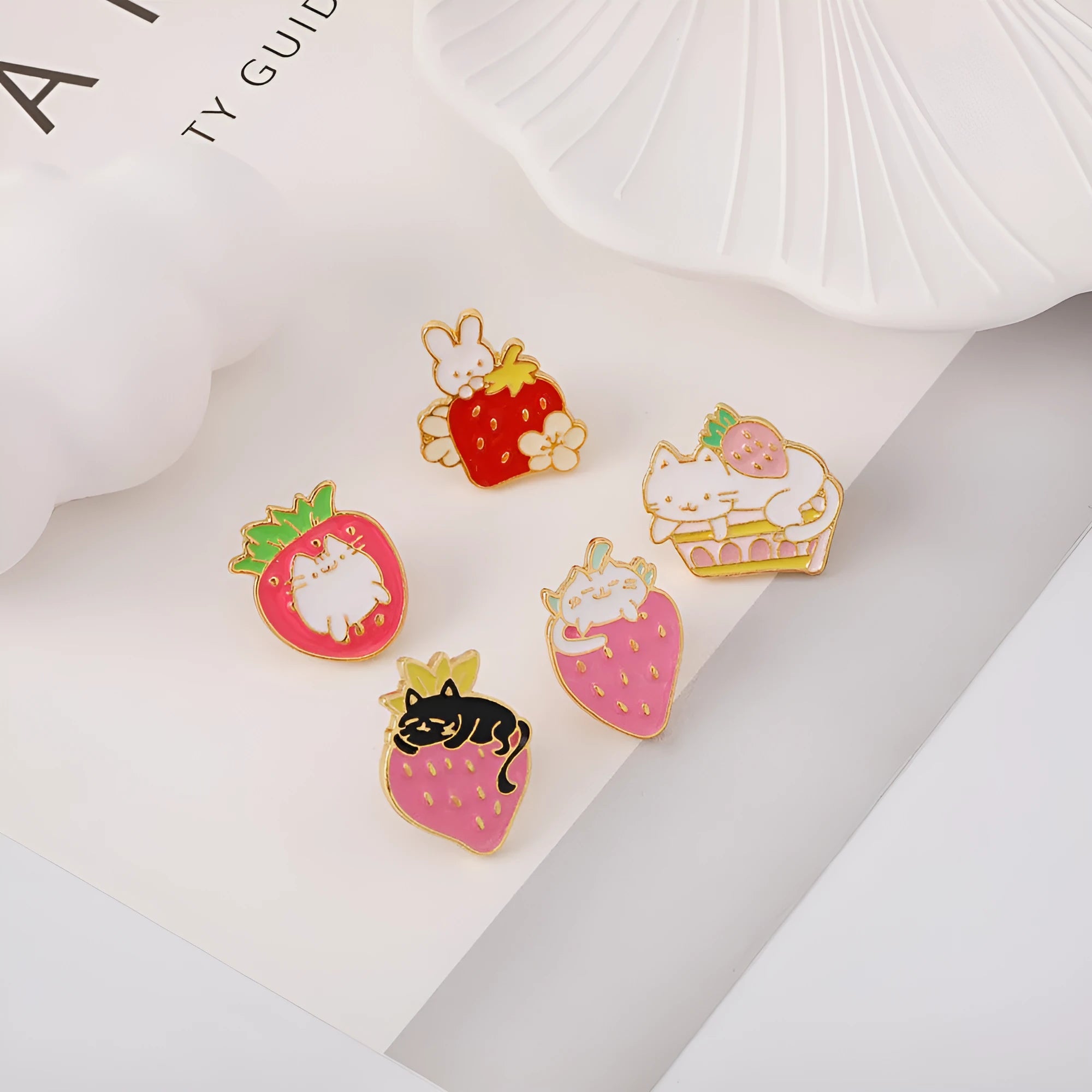 Alloy metal brooch showing a cute cat figure with a strawberry cake and dripping oil decoration.