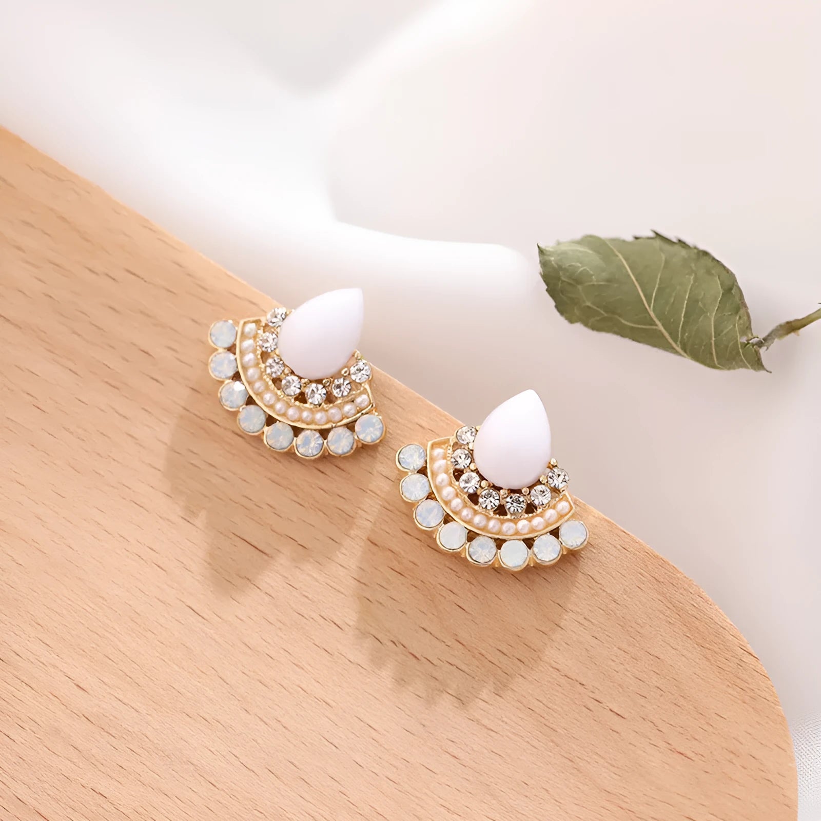 Retro fan-shaped silver colour alloy earrings with rhinestone and opal decorative details.