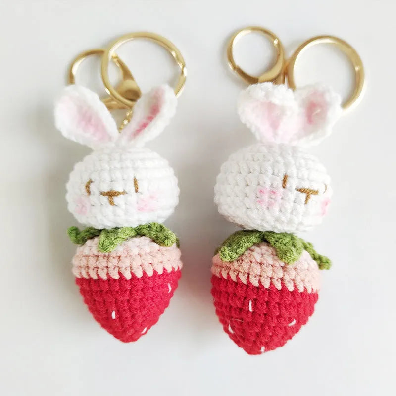 Hand-woven colourful wire pendant shaped like a rabbit with a strawberry, featuring a key loop.