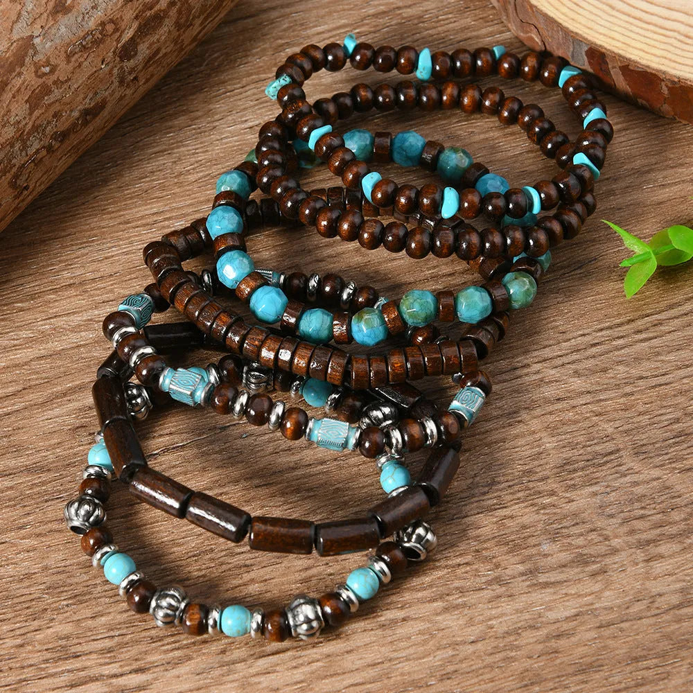 Set of seven multicolour retro bracelets with wooden beads and alloy details.