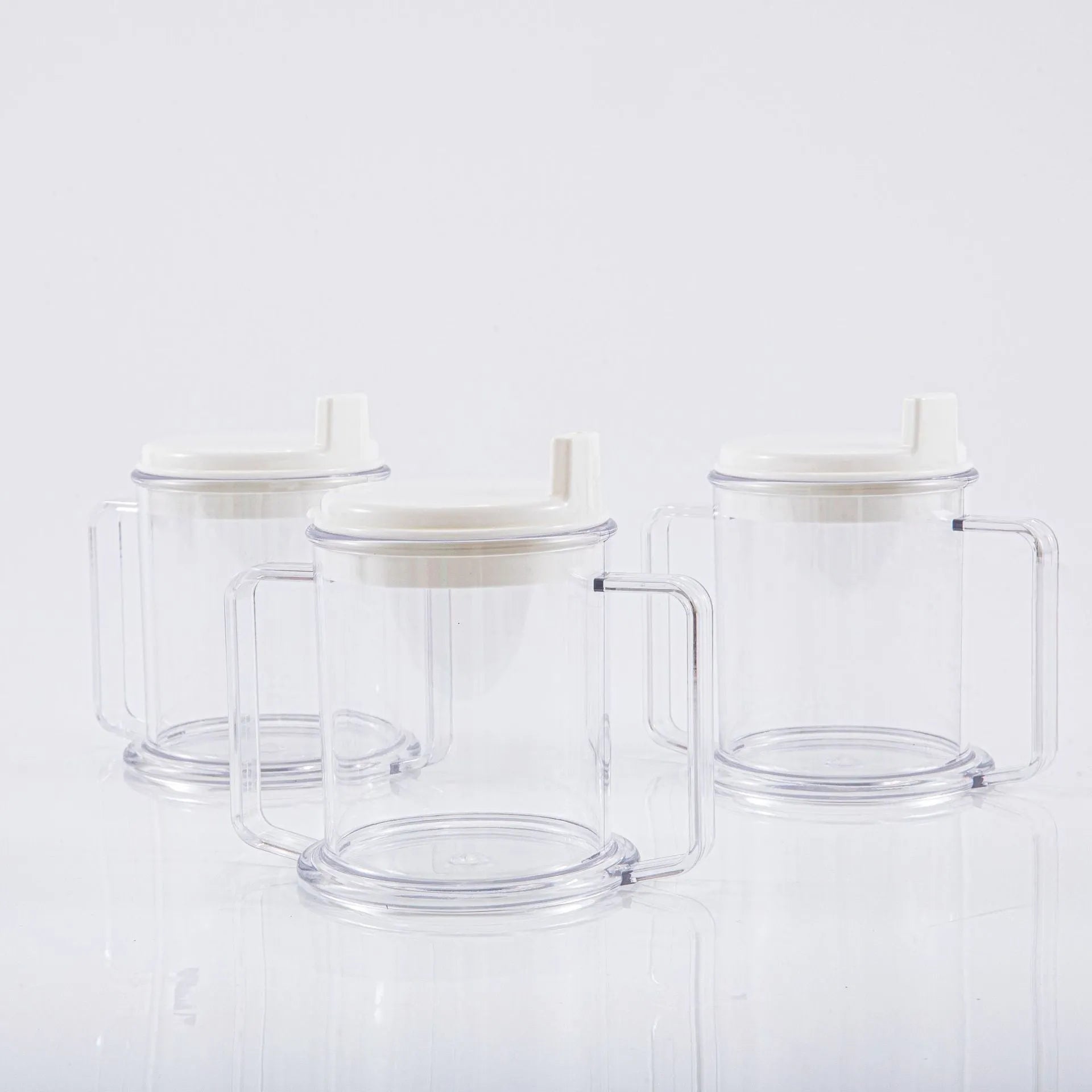 Transparent plastic drinking cup with secure lid showing dimensions and spill-proof design