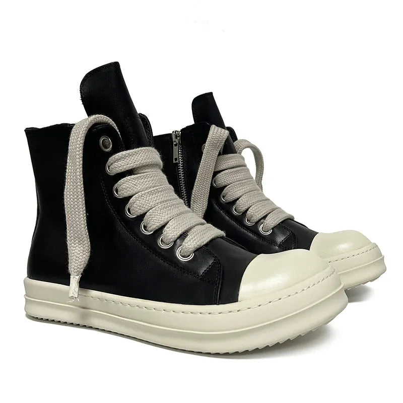 Black high-top leather sneakers with a side zipper and visible stitching on a white background.