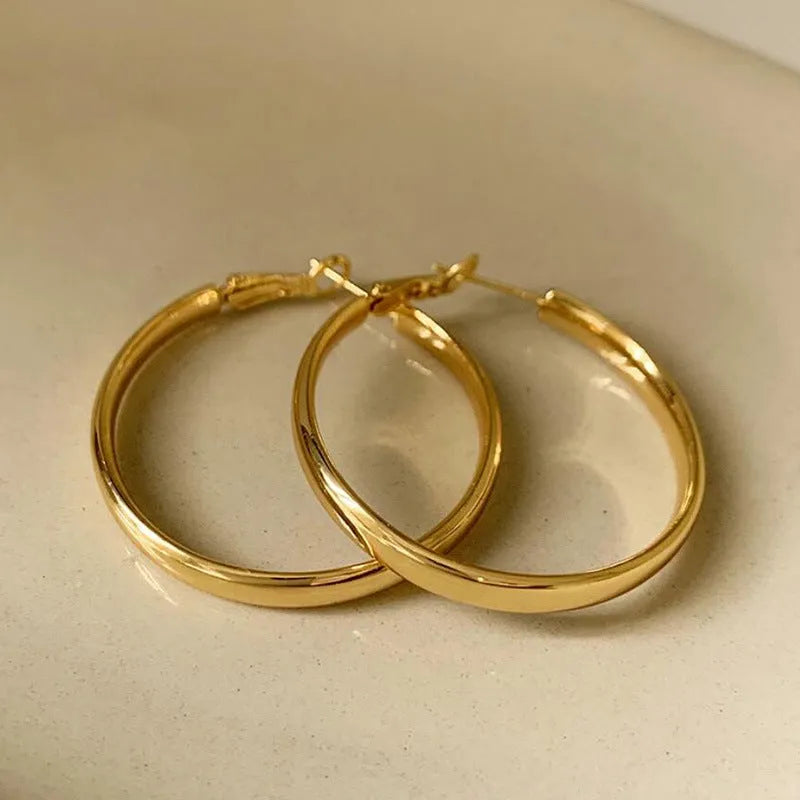 40mm circular metal earrings in gold and silver electroplated finishes