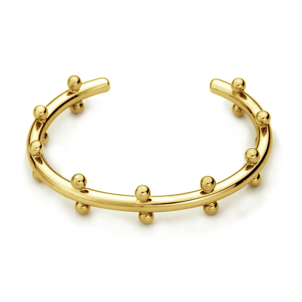 Close-up of stainless steel C-shaped textured bean beads in gold, steel, and steel-gold colours.
